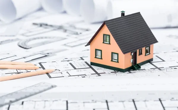depositphotos_131733270-stock-photo-construction-plans-with-drawing-tools