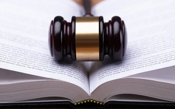 depositphotos_210431500-stock-photo-close-wooden-gavel-open-law